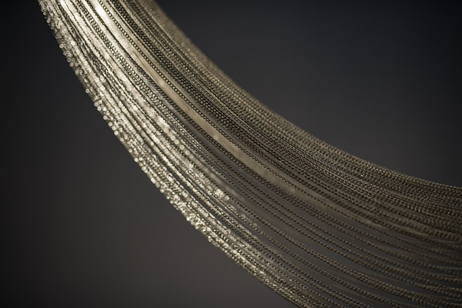 luxury-crystal-chandelier-d-voile-manooi-lighting-design Close-up of luxury crystal strands in a high-end lighting fixture.
